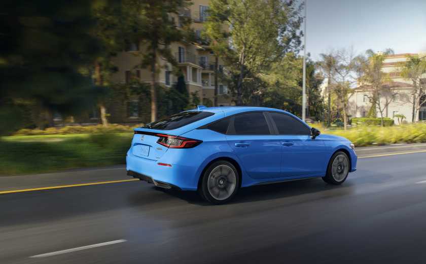 Rear 3/4 action shot of a 2025 Honda Civic