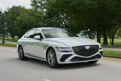 Front 3/4 action shot of a 2025 Genesis G80 
