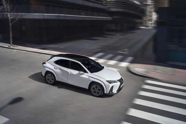 Front 3/4 action shot of a 2025 Lexus UX