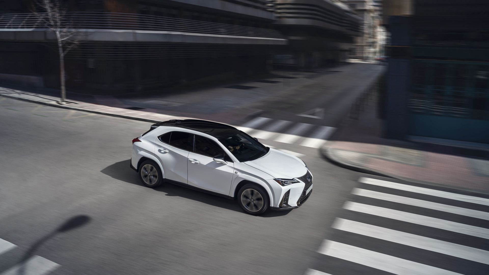 Front 3/4 action shot of a 2025 Lexus UX