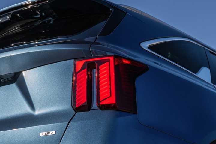 Close-up shot of the rear end of a blue 2025 Kia Sorento Hybrid.