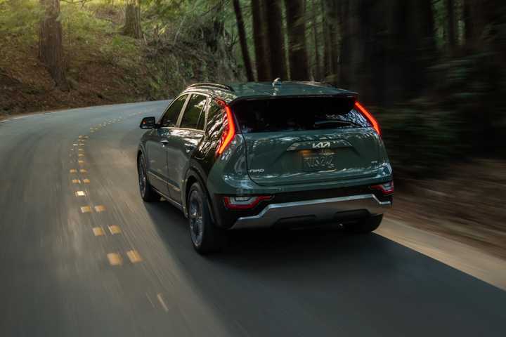Rear 3/4 action shot of a 2025 Kia Niro