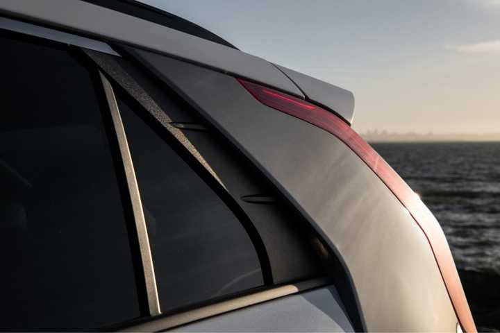 Close-up shot of the rear light on a white 2025 Kia Niro EV.