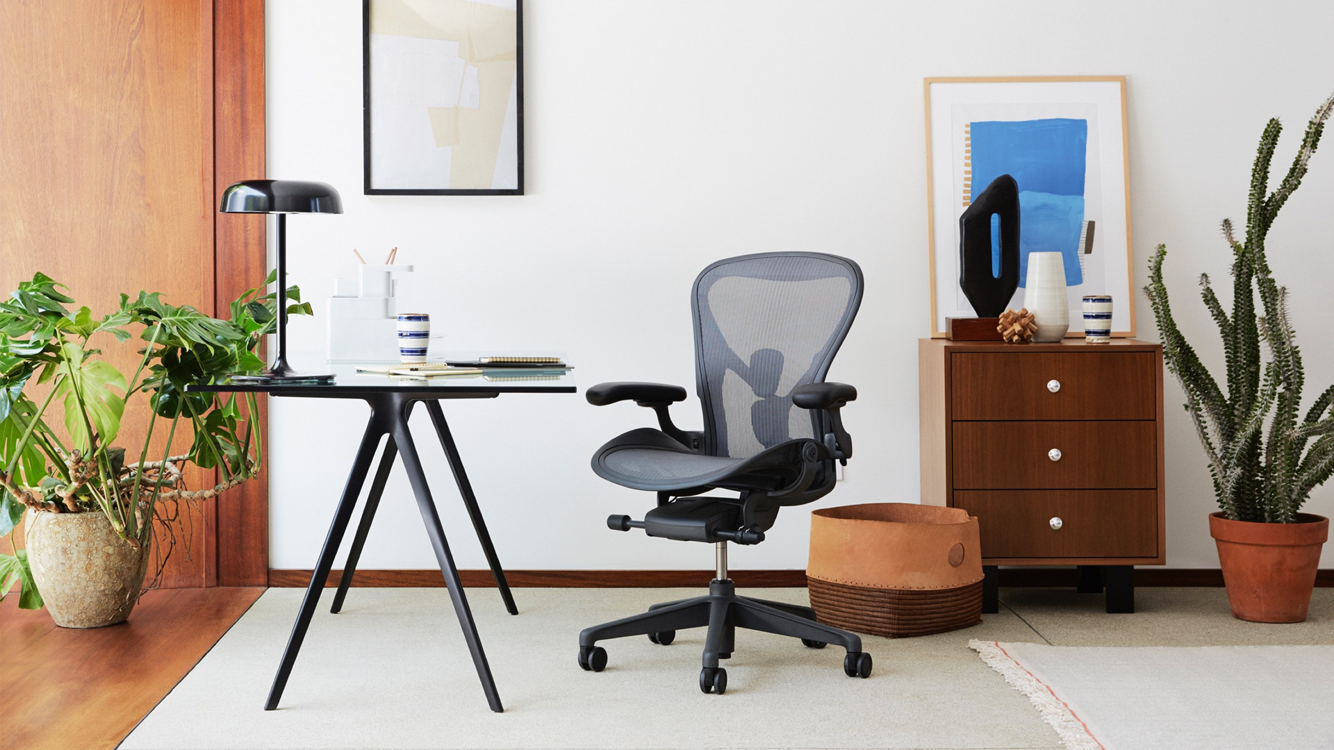 The Herman Miller Aeron office chair in a mid-century modern office.
