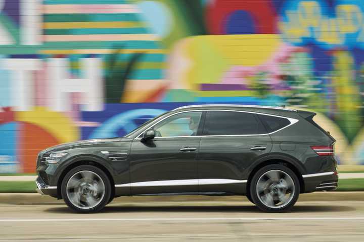 Side-profile action shot of a 2025 Genesis GV80