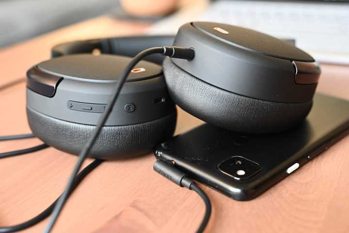 Edifier WH950NB using wired mode by having an AUX cord plugged into the headphones and a phone