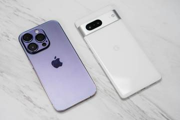 An iPhone 14 Pro and a Google Pixel 7 laid next to each other