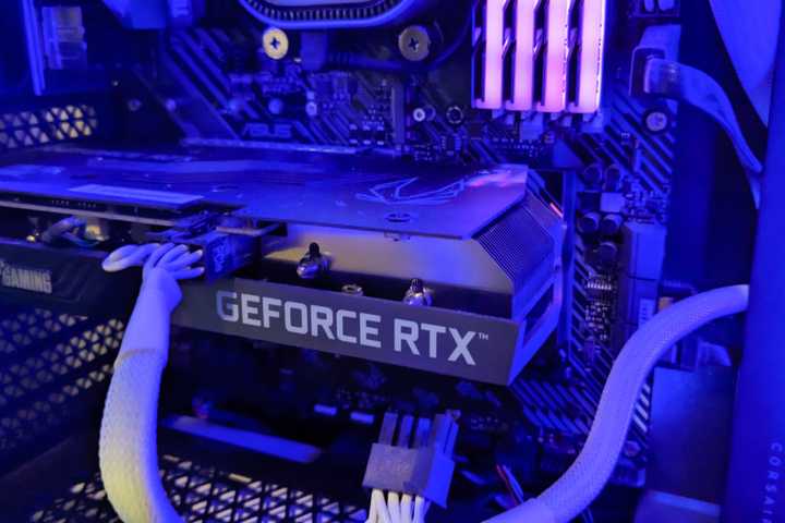A Geforce RTX 3050 Ti GPU inside a computer tower.