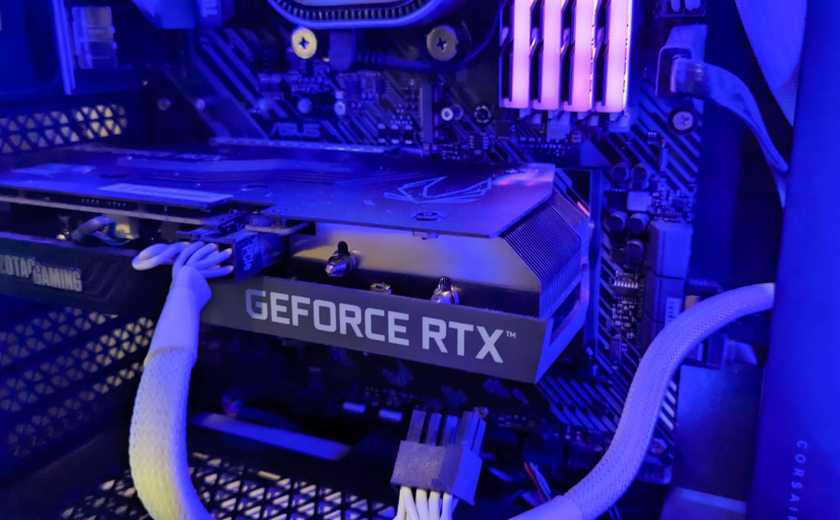 A Geforce RTX 3050 Ti GPU inside a computer tower.