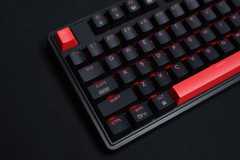 A keyboard with red Escape button and a red Spacebar. 