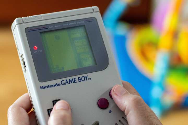 A Game Boy console playing Tetris.