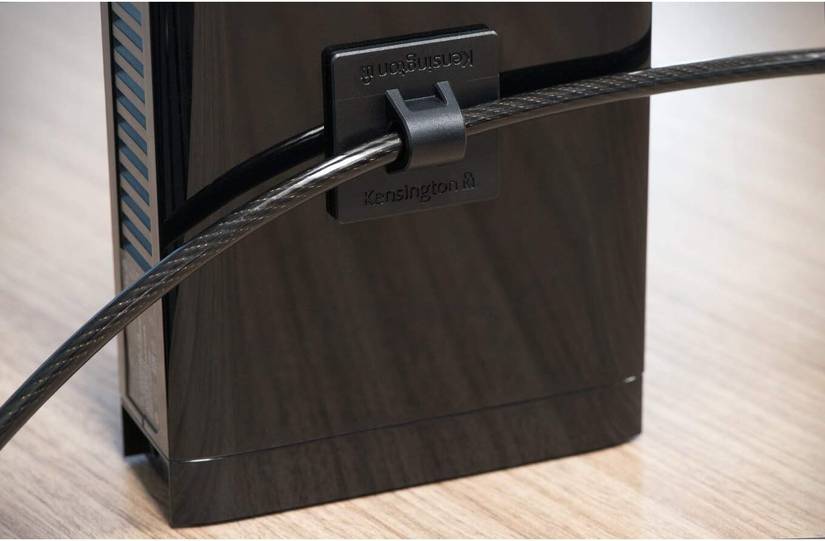 A Kensington desktop lock kit protecting a device.