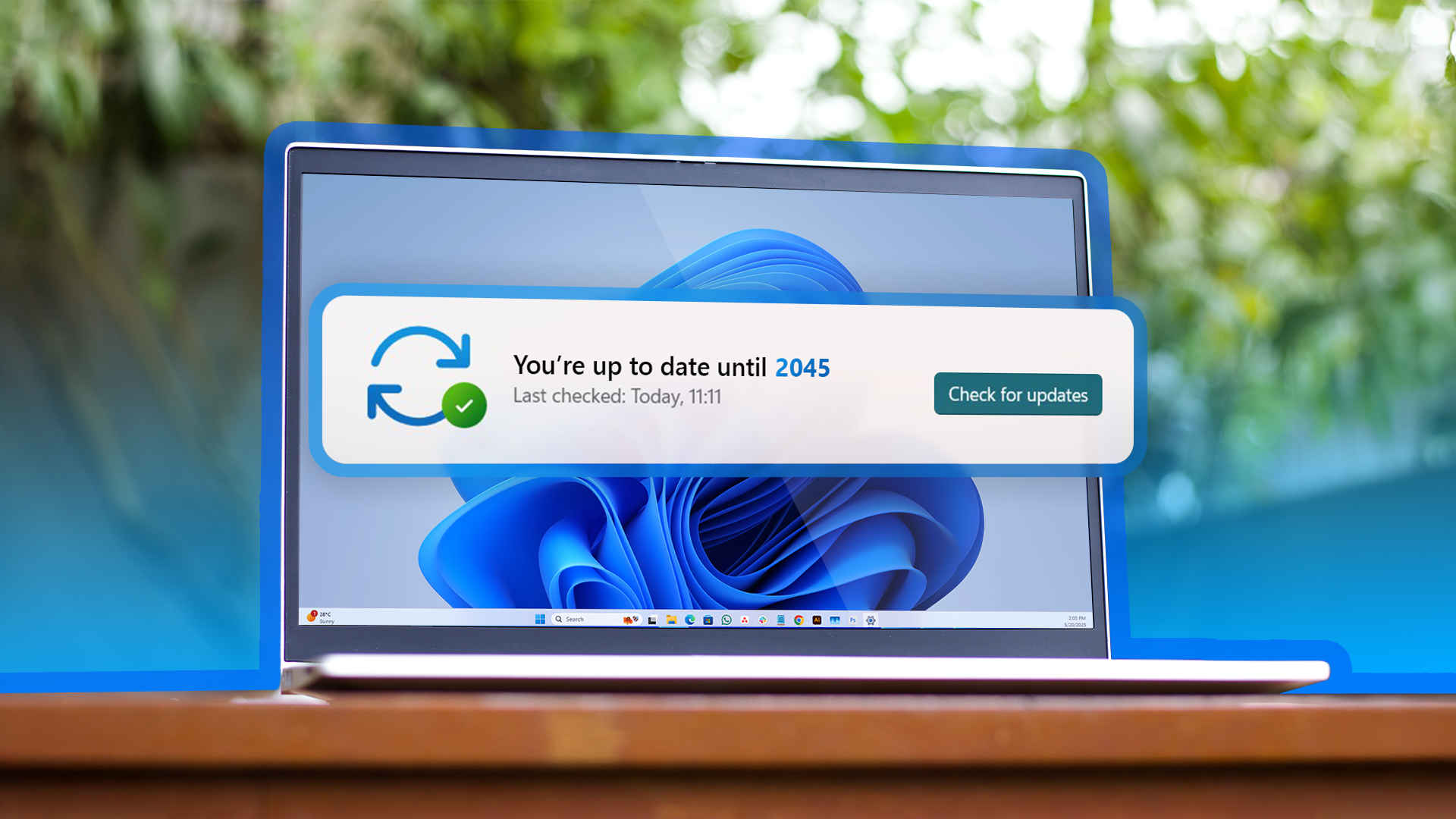 A laptop running Windows 11 displaying a notification that says 'You're up to date until 2045.'