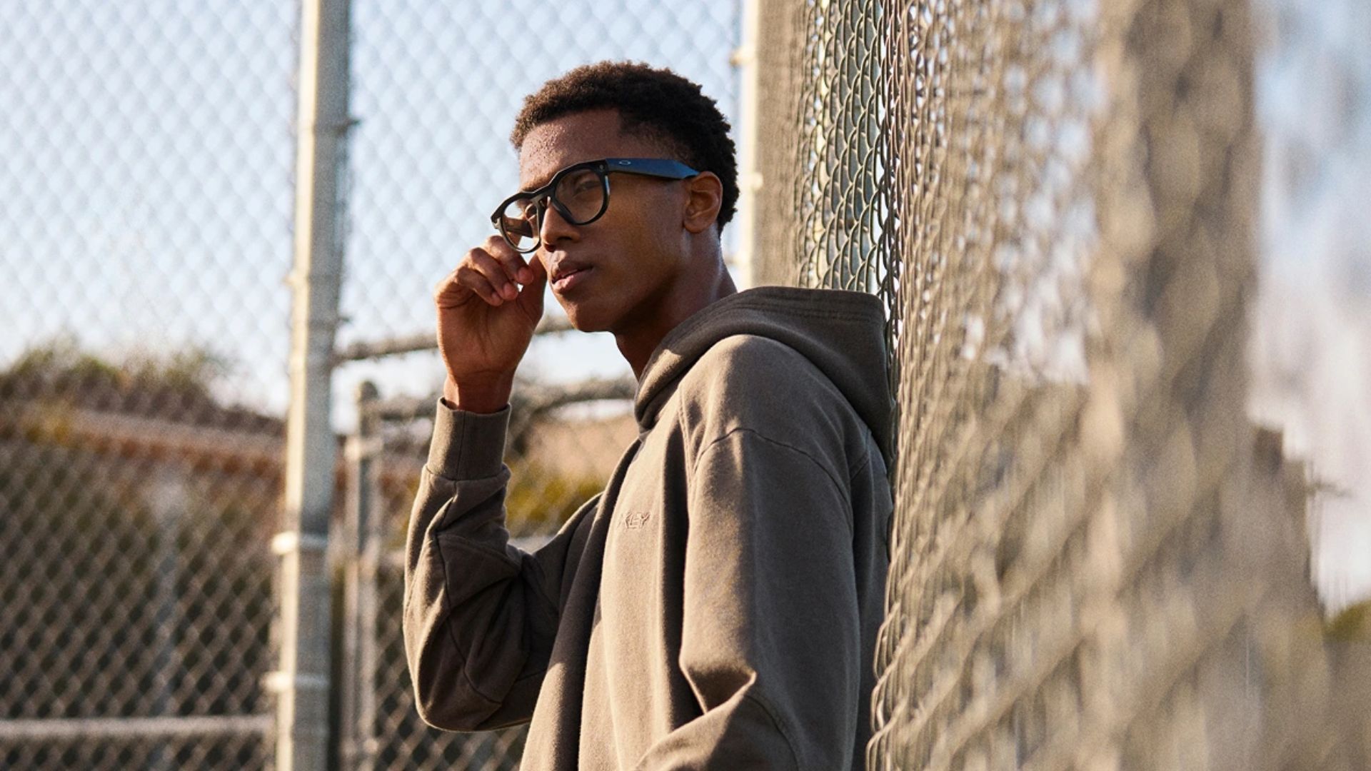 A man wearing the Meta Oakley HSTN smart glasses.