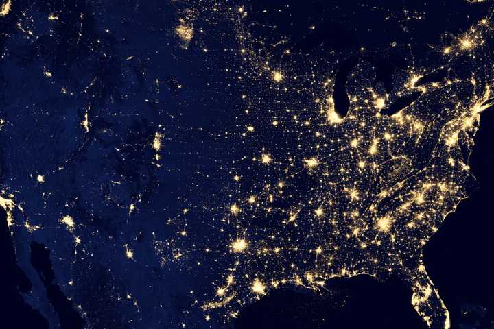 A photograph taken from space of the city lights of the United States.