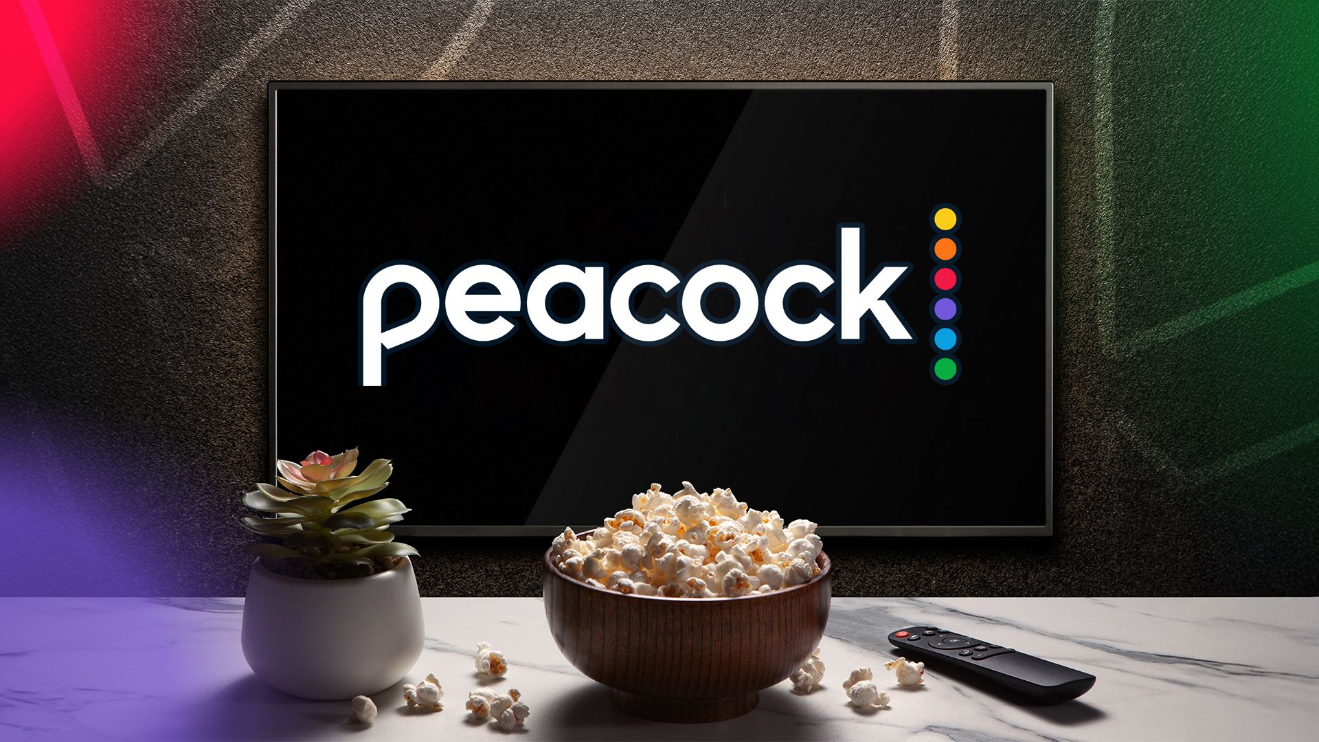 A TV displaying the Peacock logo, with a bowl of popcorn, a remote control, and a plant in front.