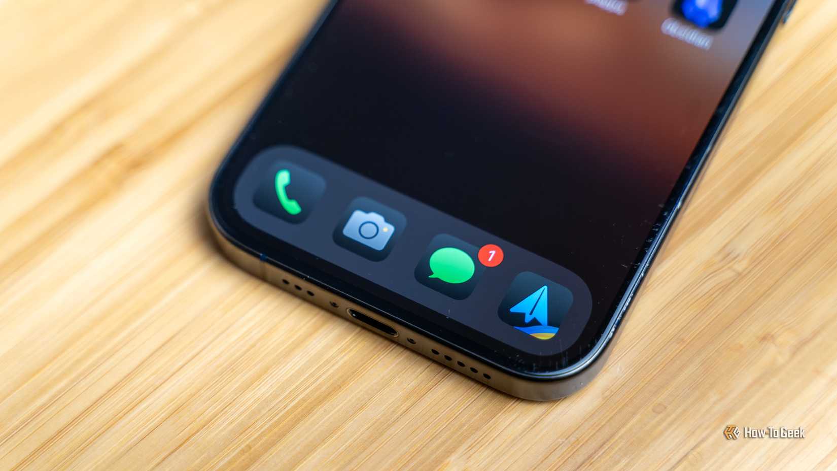 The app dock of an iPhone with the phone, camera, messages, and Spark email app docked.