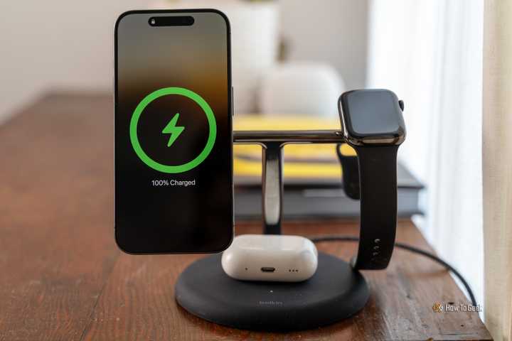 The Belkin BoostCharge Pro 3-in-1 MagSafe charger with an iPhone, Apple Watch, and AirPods charging.