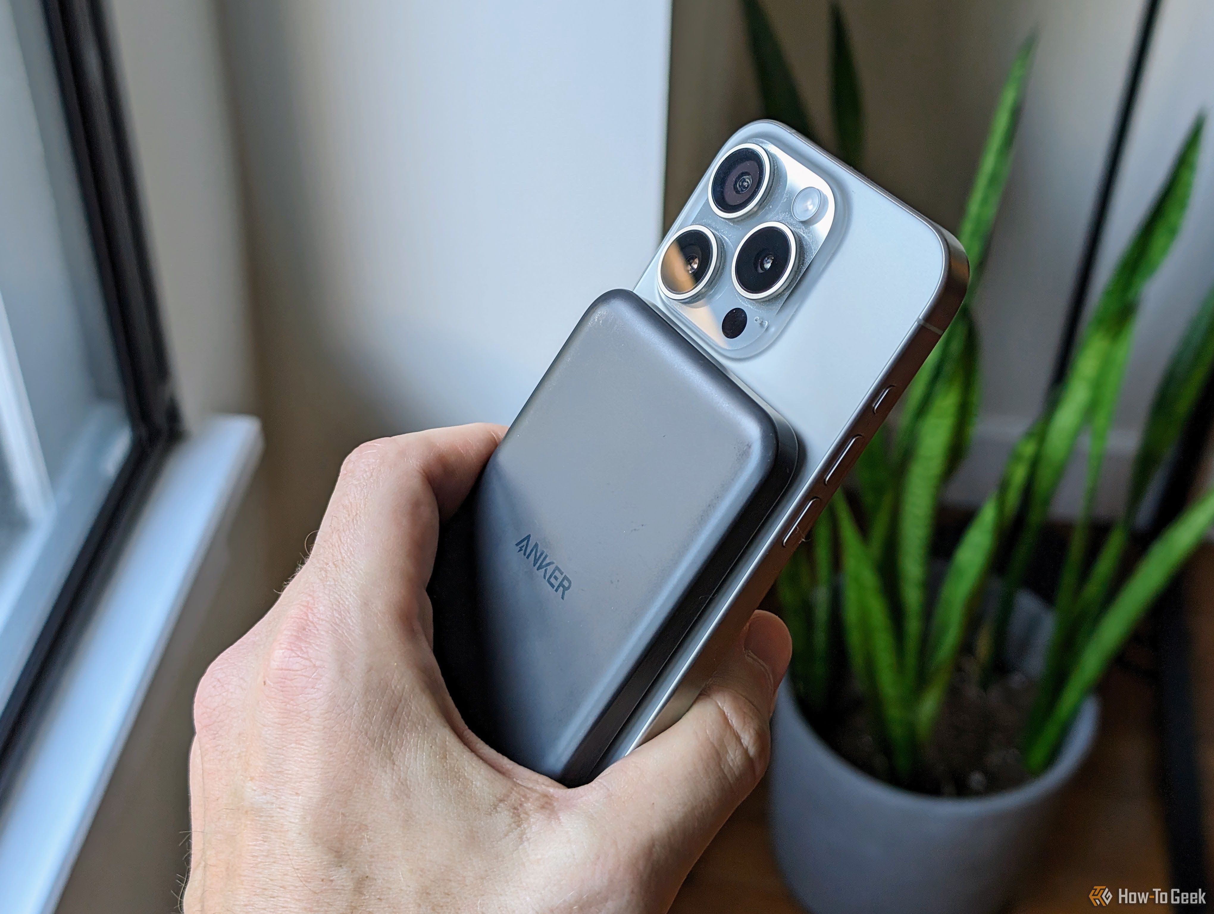 Anker MagSafe battery pack on an iPhone 15 Pro.