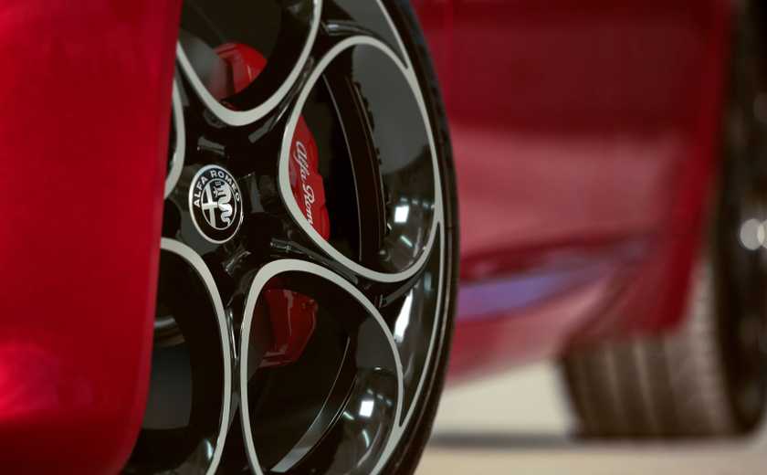 Close-up shot of the alloy wheel on a red 2022 Alfa Romeo Giulia.