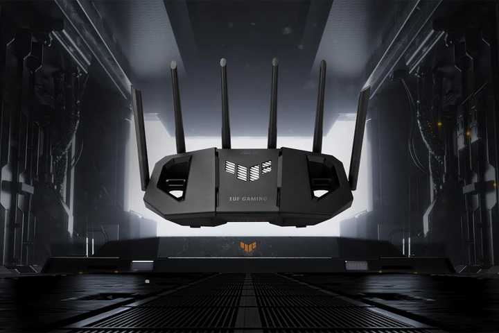 ASUS TUF Gaming BE9400 Tri Band WiFi 7 over a place that looks like an airplane hanger