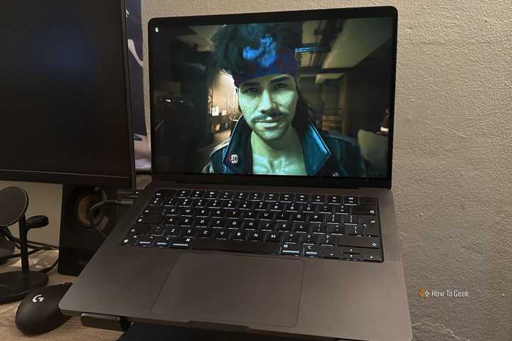 Cyberpunk 2077 running on a MacBook.