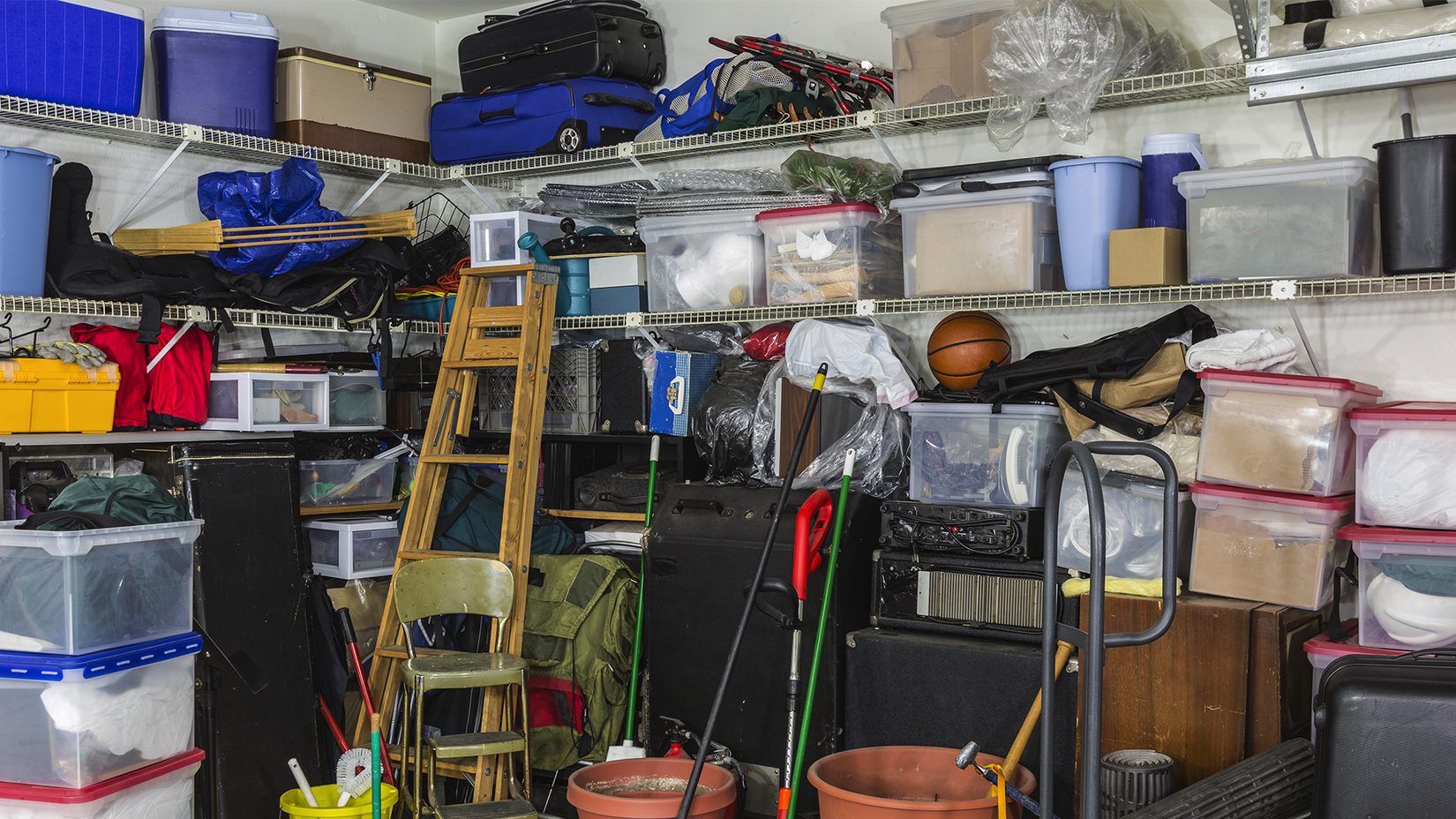 A messy garage filled with stuff.