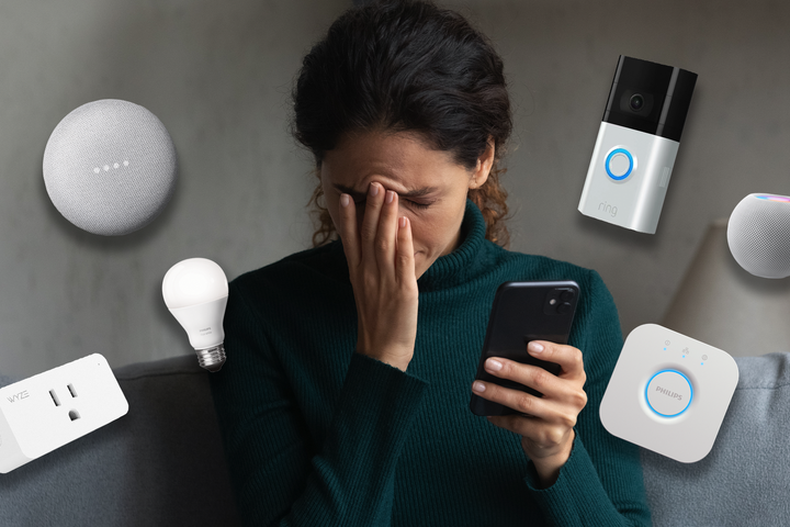 A woman looking frustrated surround by smart home tech.