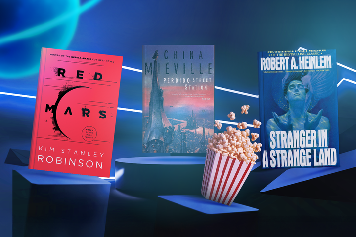 Futuristic setting with three books side by side and a popcorn bucket in the center.