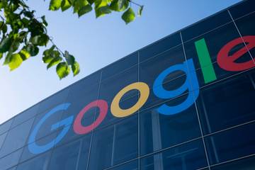 An image of Google's offices in Mountain View, CA. There is a large Google logo on the front of the building.