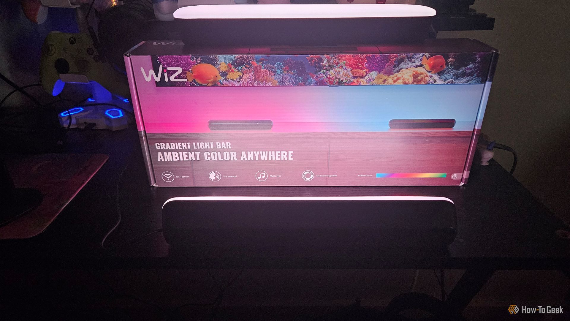 The WiZ Gradient Light Bars illuminating the box they came in.