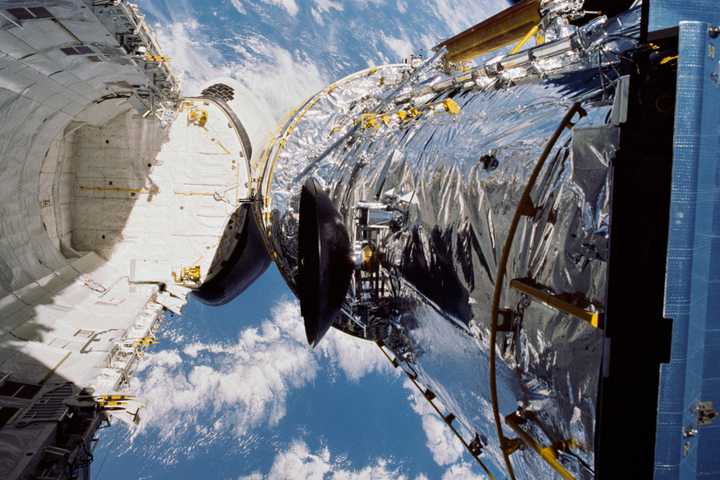 Hubble deploying from the Space Shuttle Discovery.