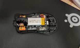 A disassembled gaming mouse.
