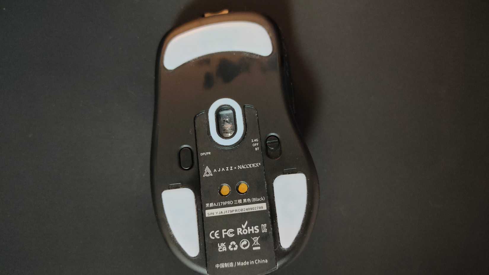 The mouse skates and underside of the Ajazz AJ179 Pro gaming mouse.