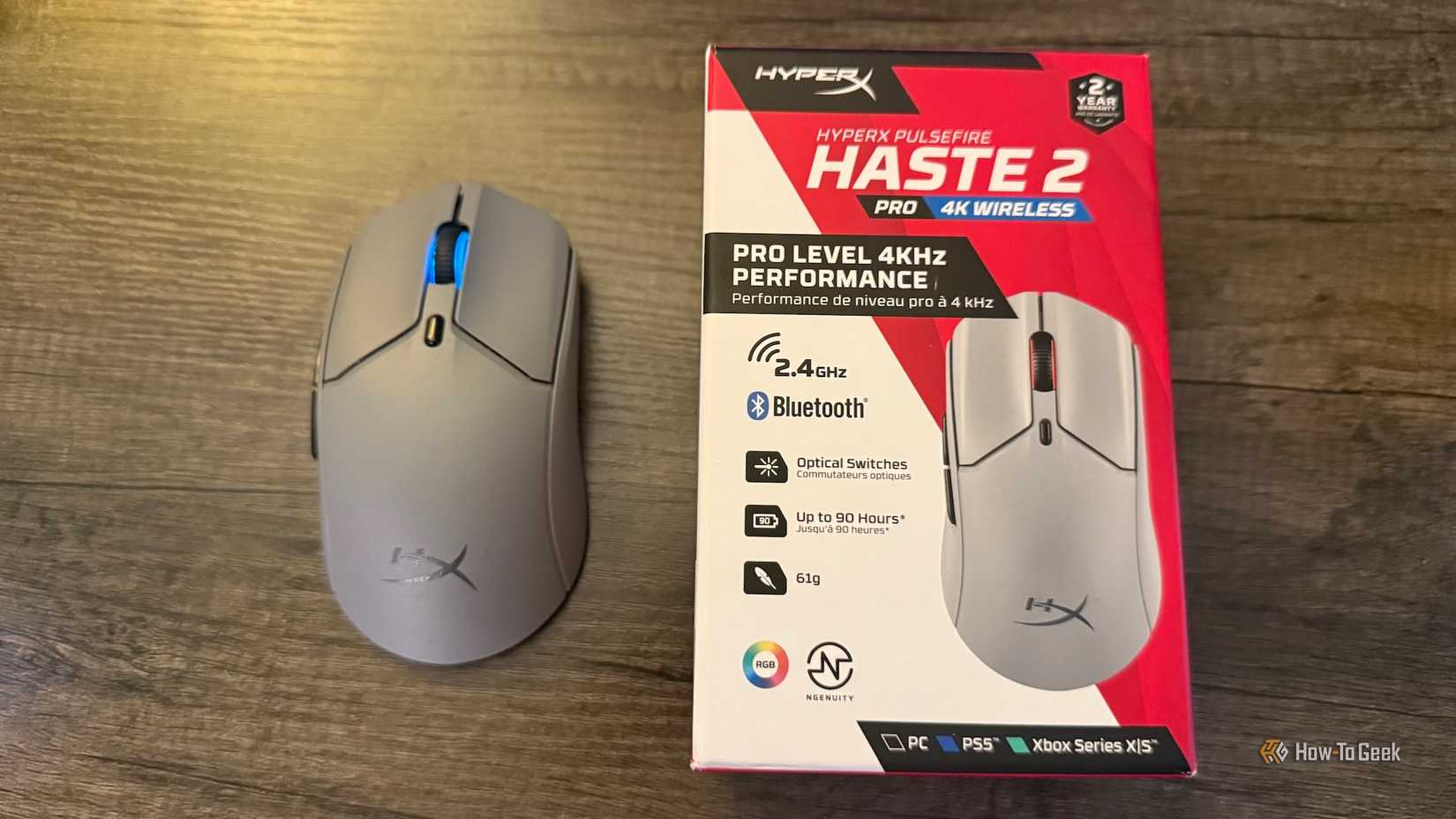 The HyperX Pulsefire Haste 2 Pro from above and its box on a table.