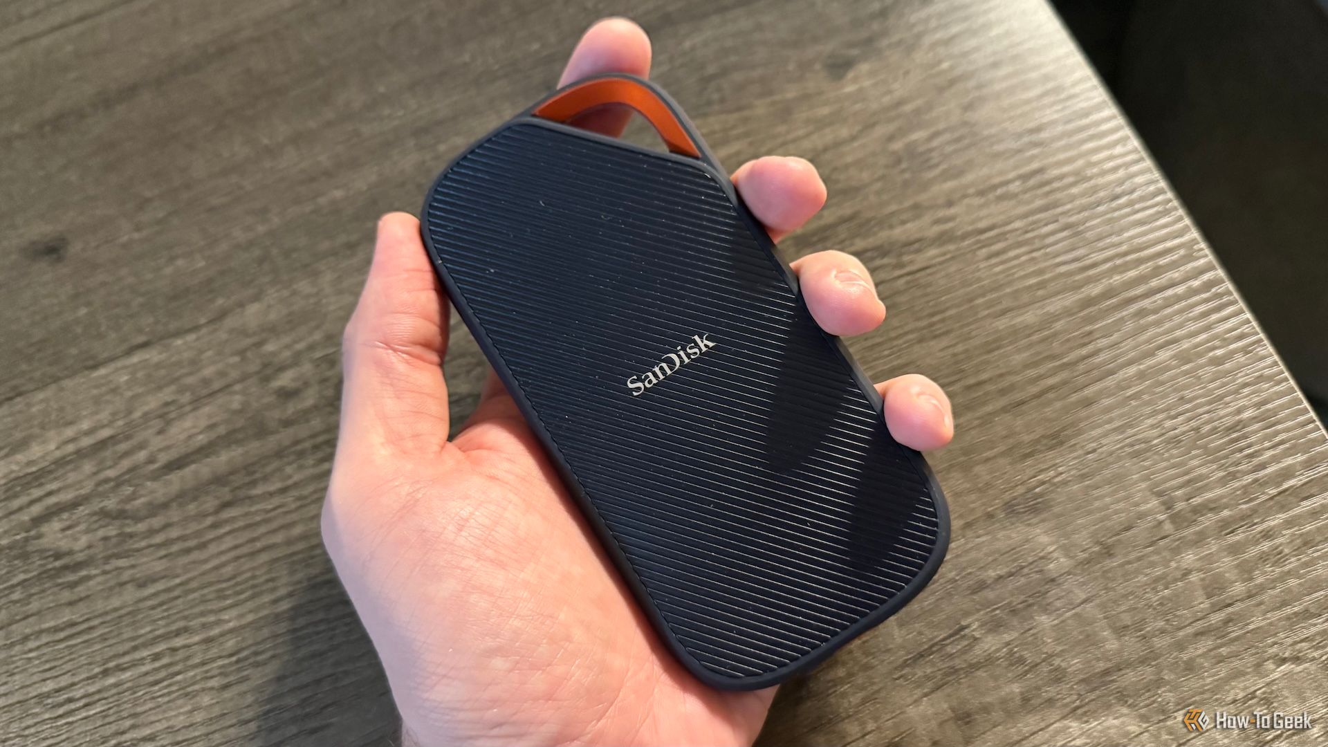 A hand holds the SanDisk Extreme PRO Portable SSD with USB4.