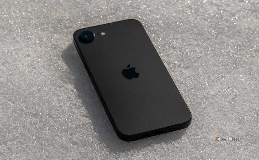 iPhone 16e face down on snow.