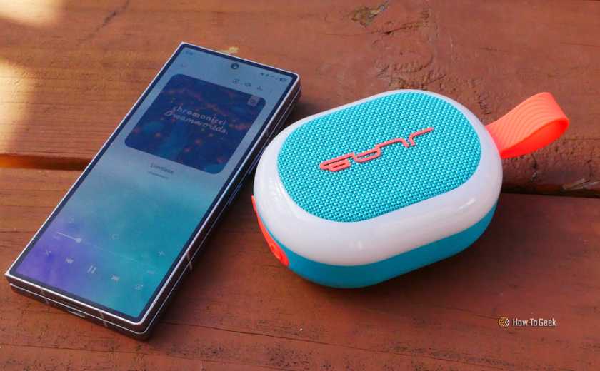 JLab Pop Party next to a Samsung Galaxy Z Fold 6