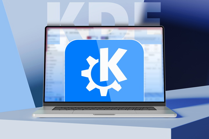 Laptop showing the KDE logo on screen, with a blue and purple background and 'KDE' in large letters behind it_