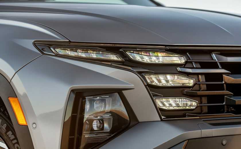 Close-up of the friont end of a gray 2025 Hyundai Tucson PHEV.