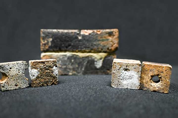Flawed bricks and bricks mended with bacteria-infused slurry.