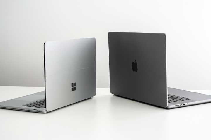 Microsoft Windows Surface laptop and Apple MacBook Pro.