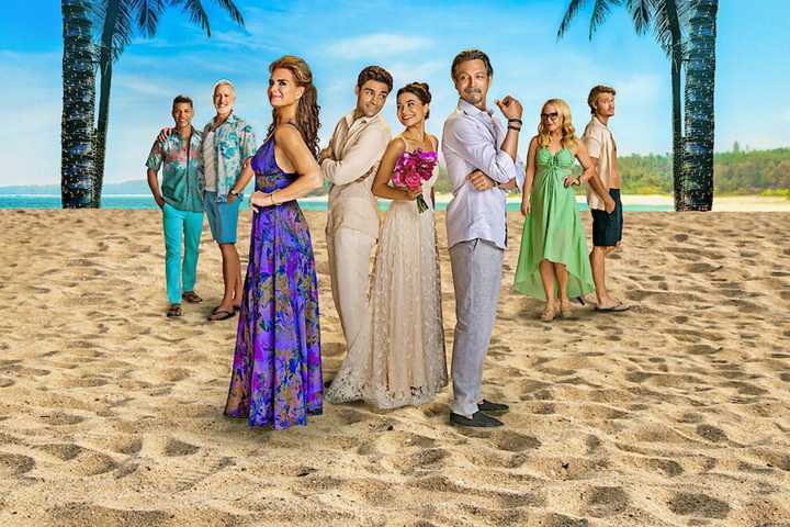 Mother of the Bride Cast Standing on a Beach.