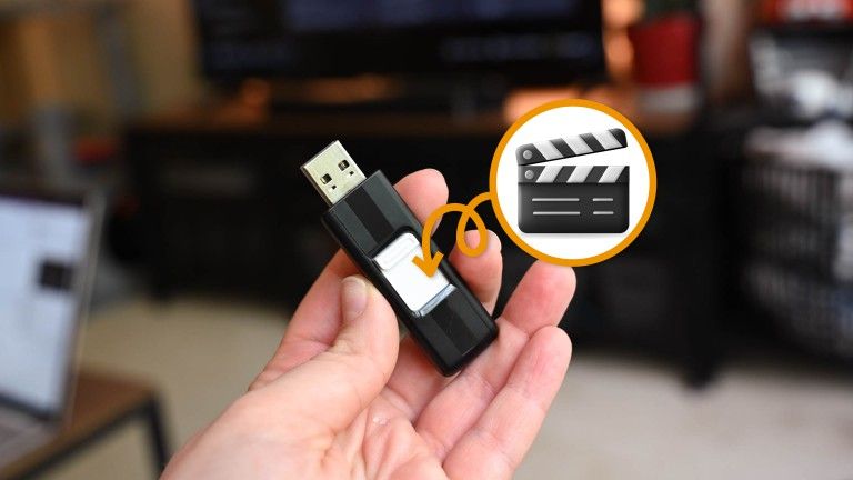 USB stick in hand with movie icon
