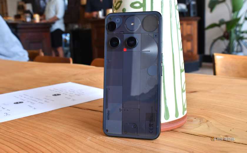 nothing phone 3 rear panel wide shot in cafe.