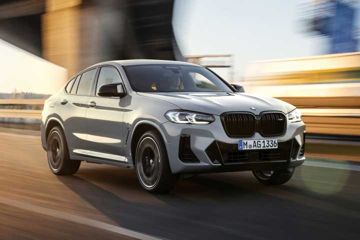 Front 3/4 action shot of a 2022 BMW X4