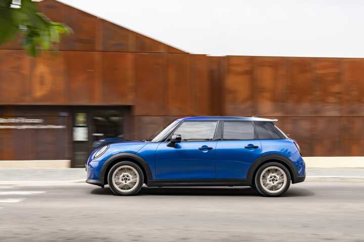 Side profile action shot of a 2026 Mini Cooper