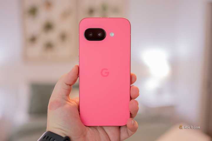 Person holding the Google Pixel 9a showing the back of the phone.
