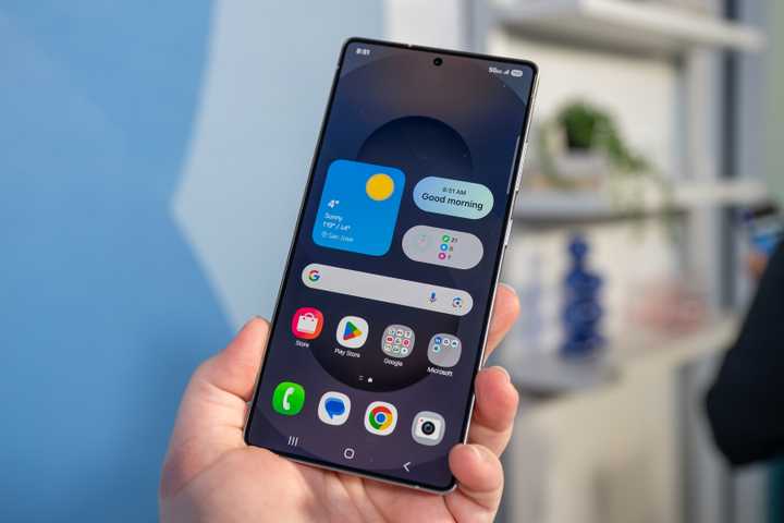Person holding the Samsung Galaxy S25 Ultra looking at the display.
