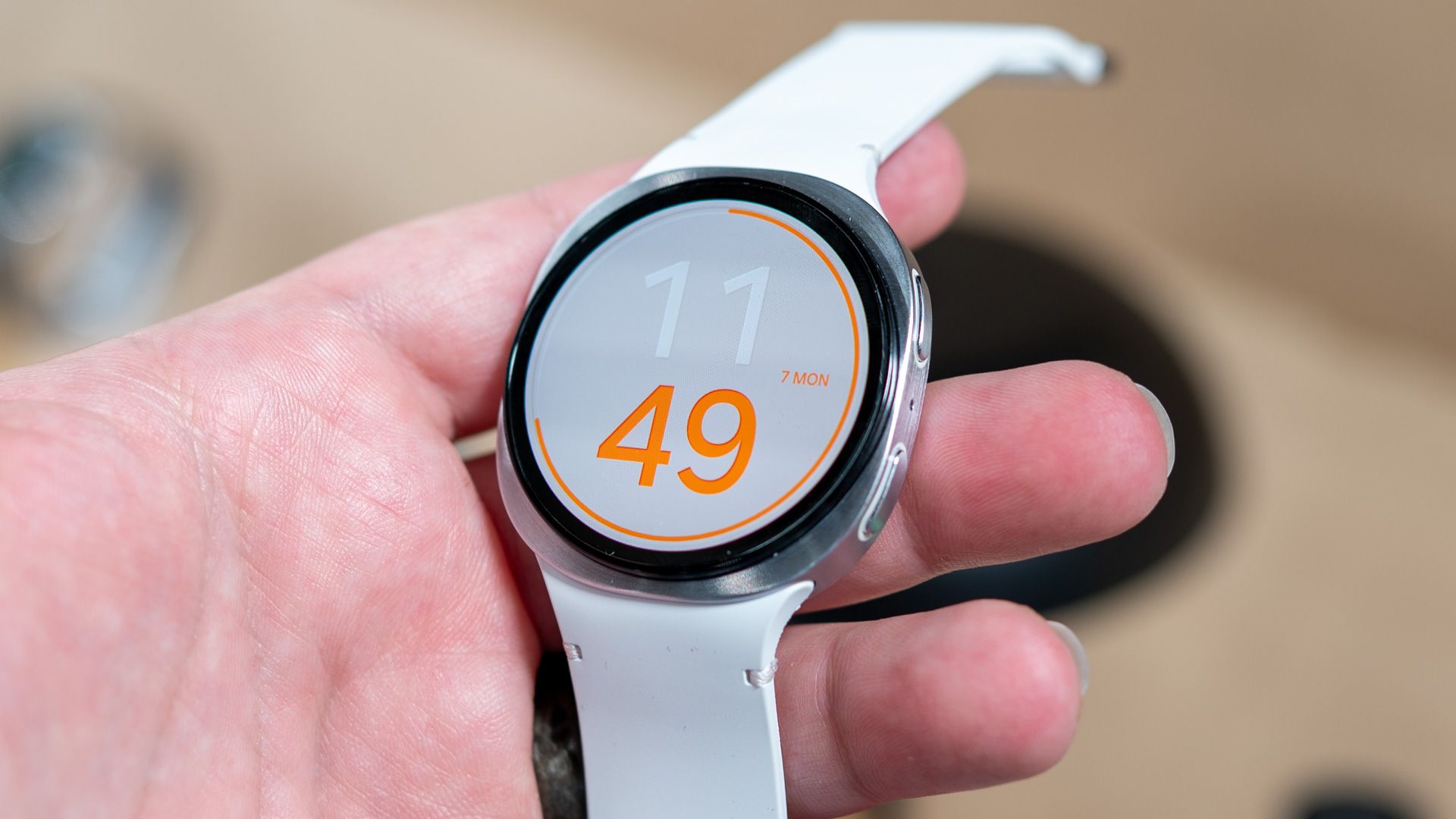 Person holding the samsung galaxy watch 8.